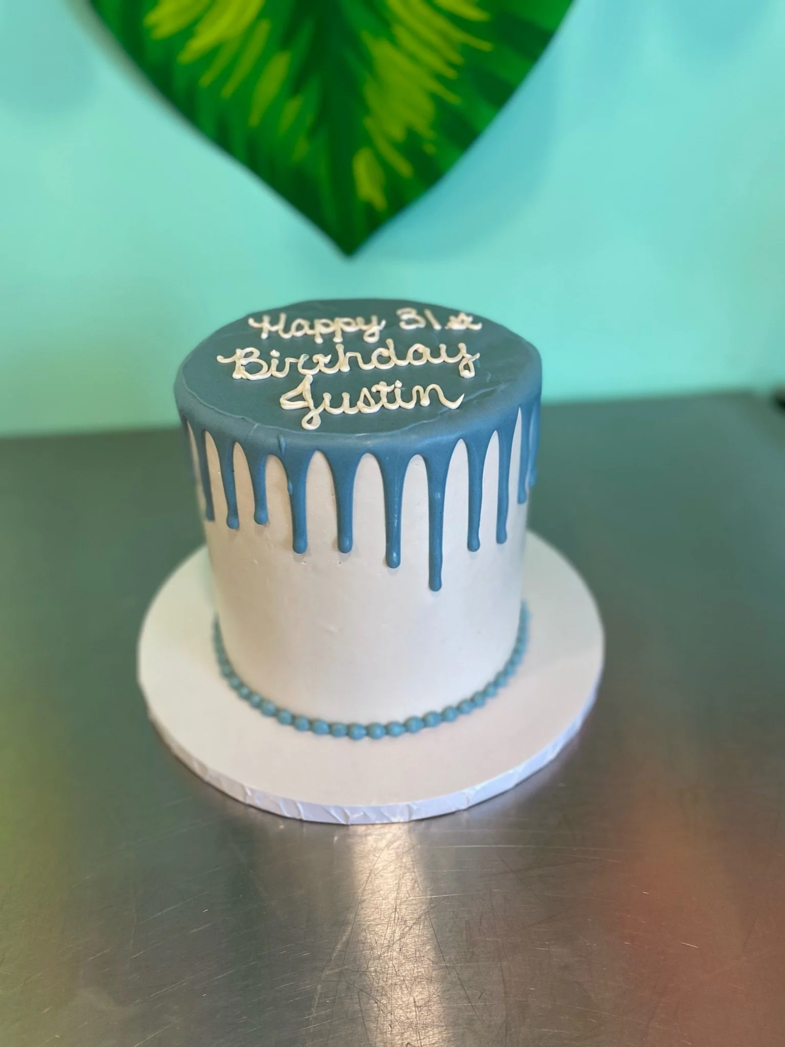 Blue white silver drip birthday cake