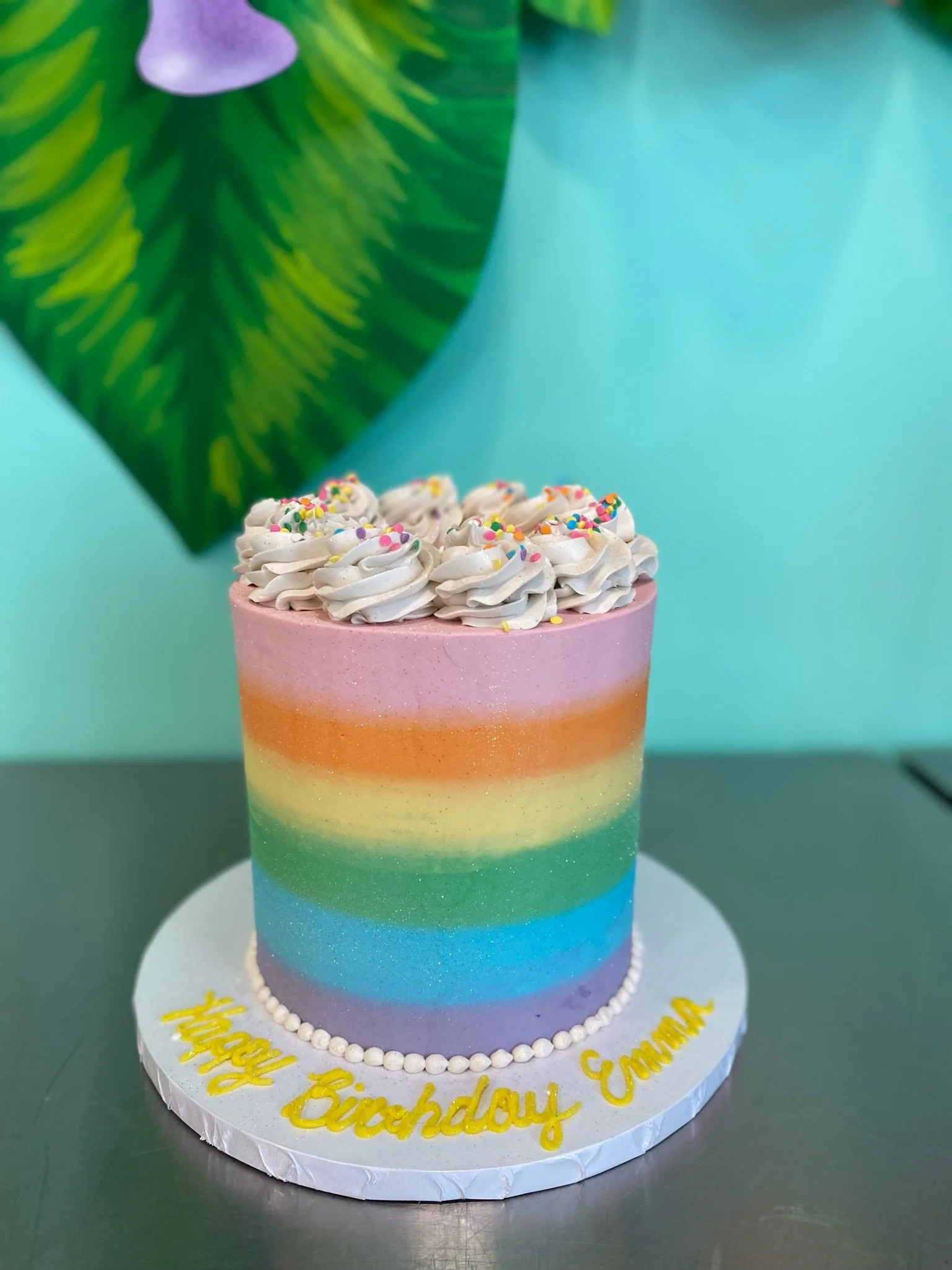 Pastel rainbow striped two tier cake