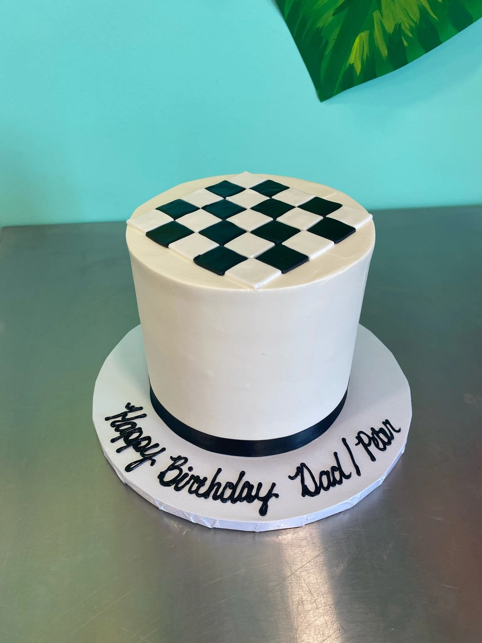 White black checkerboard race themed cake