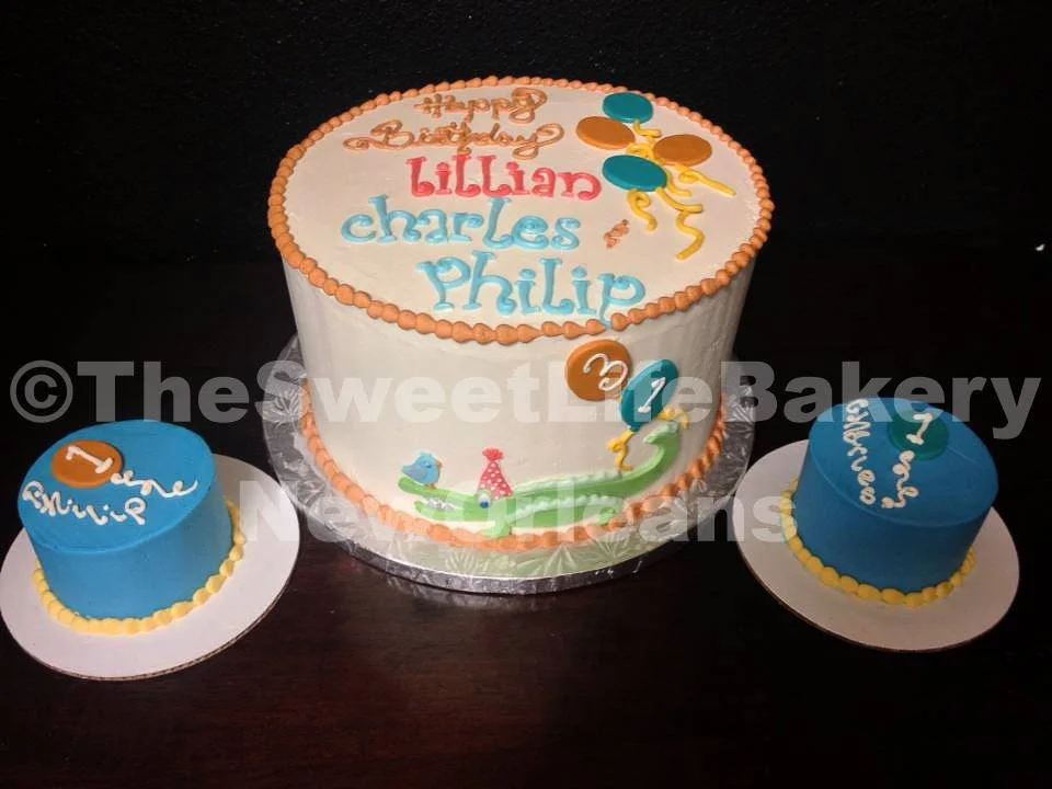 White blue personalized first birthday cake