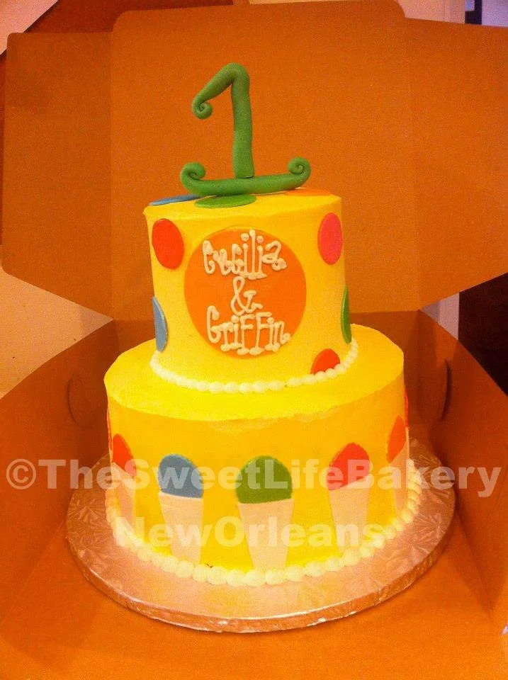 Yellow orange first birthday cake number one