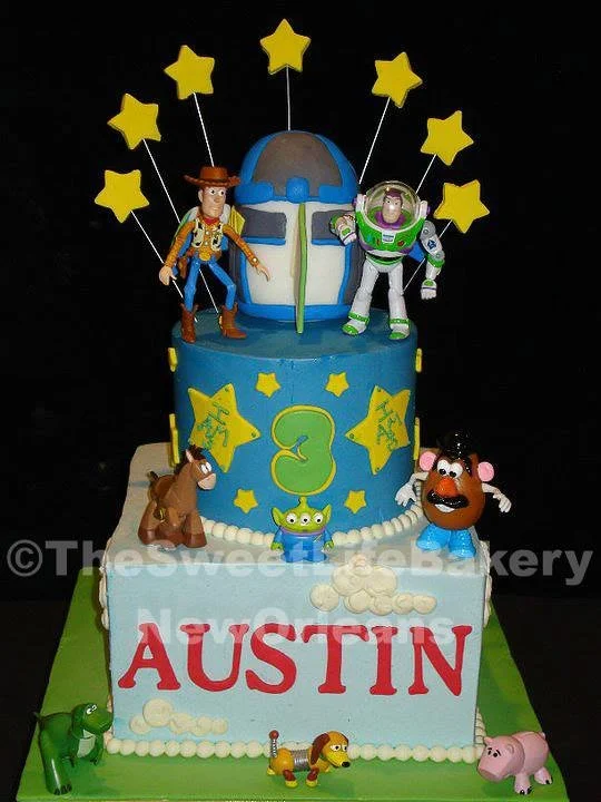 Blue gold space rocket astronaut birthday cake