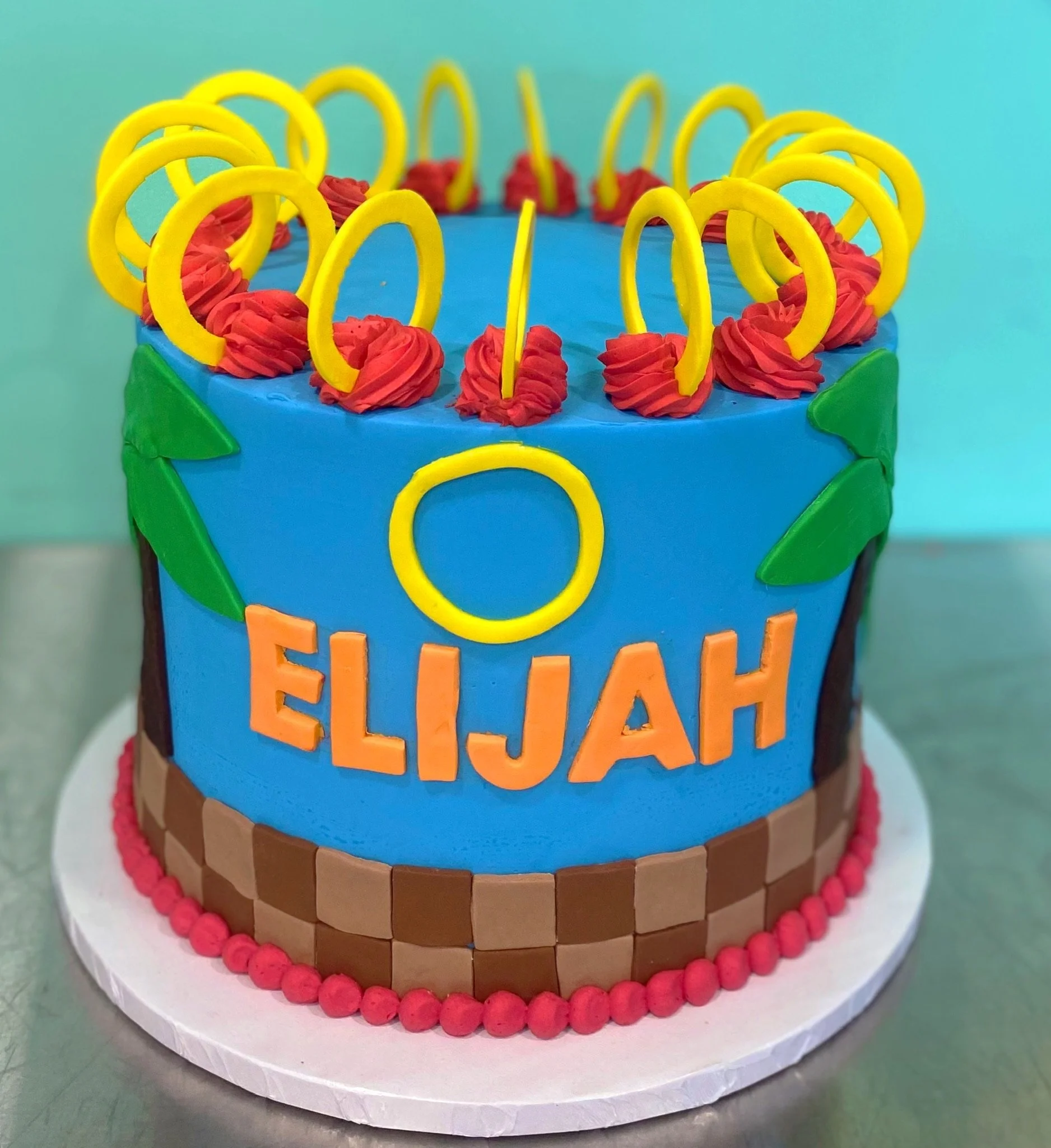 Blue yellow rainbow lollipop sprinkles birthday cake