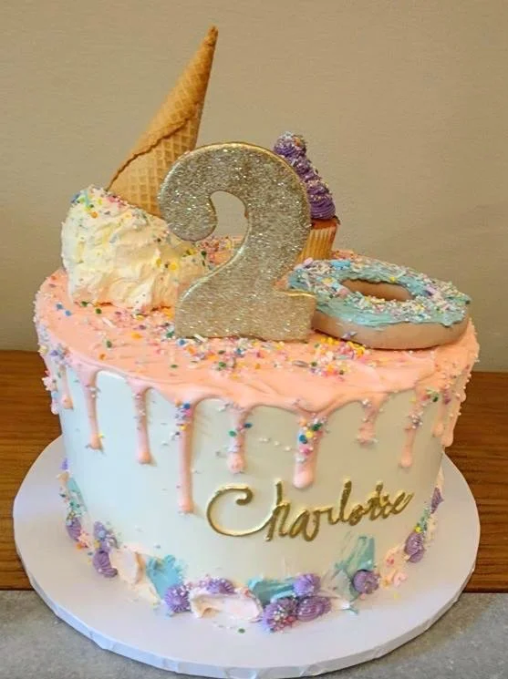 Pink unicorn birthday cake rainbow horn