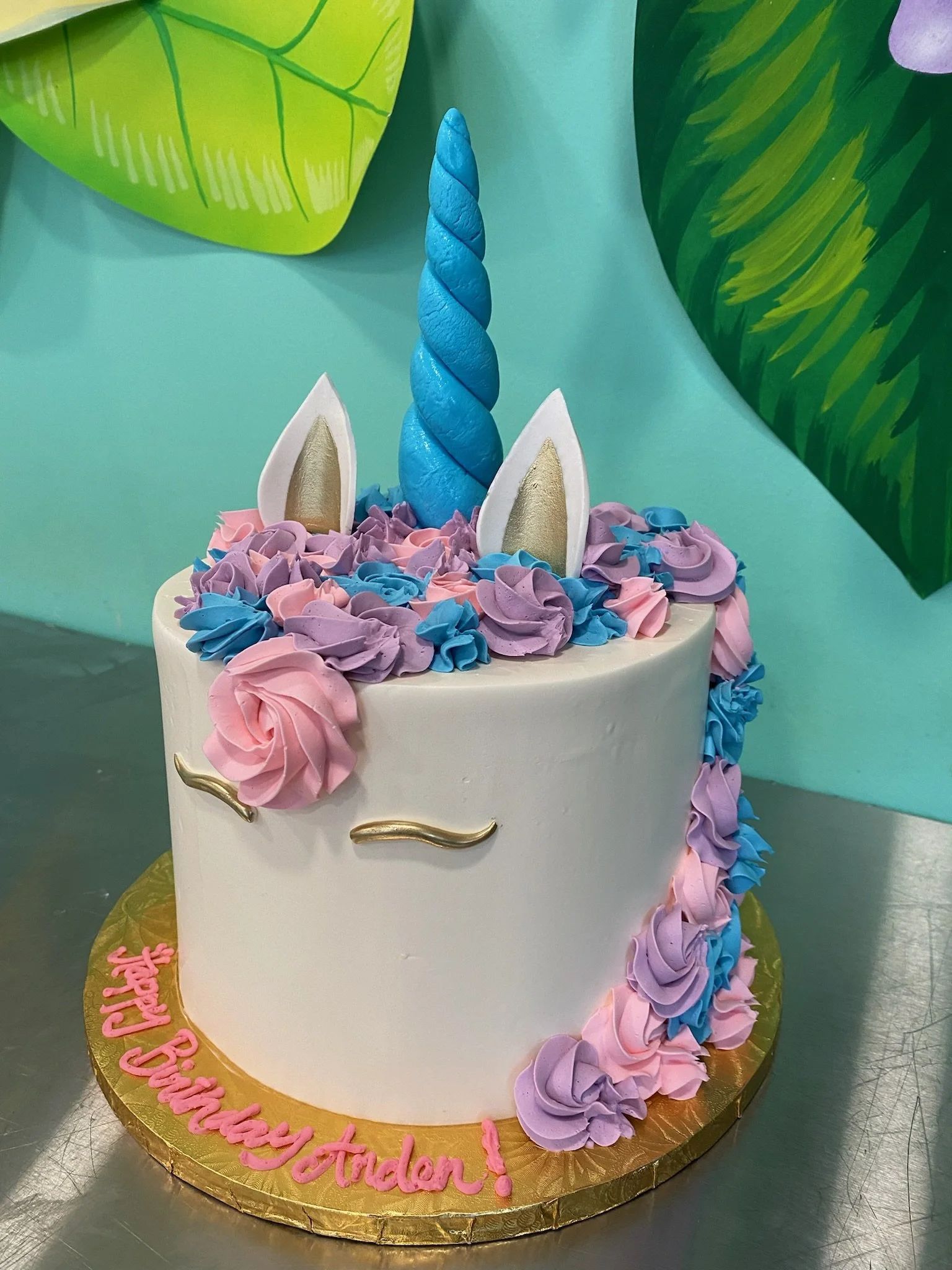 White blue purple unicorn cake pastel flowers