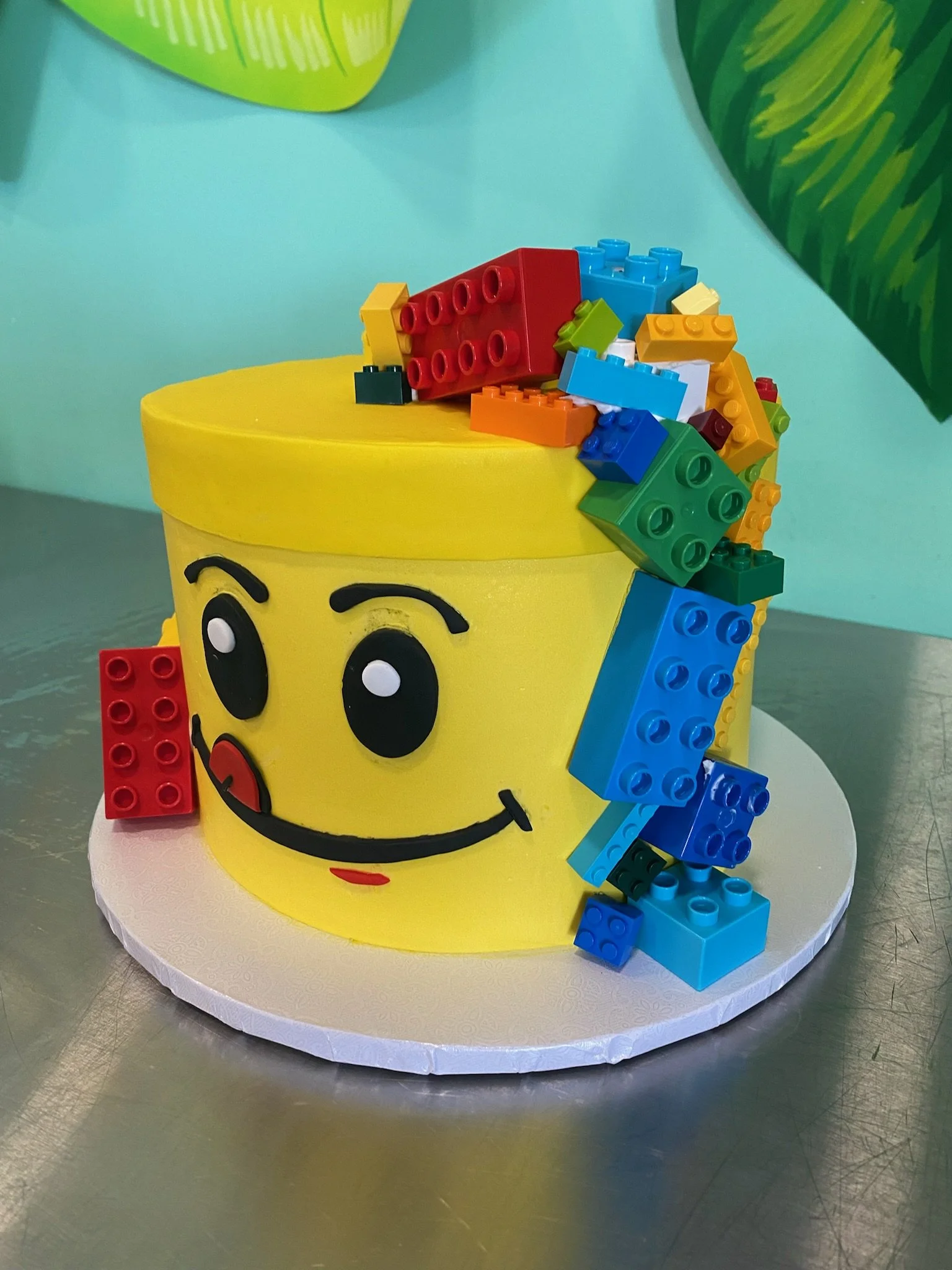 Yellow lego bricks character sculpted birthday cake