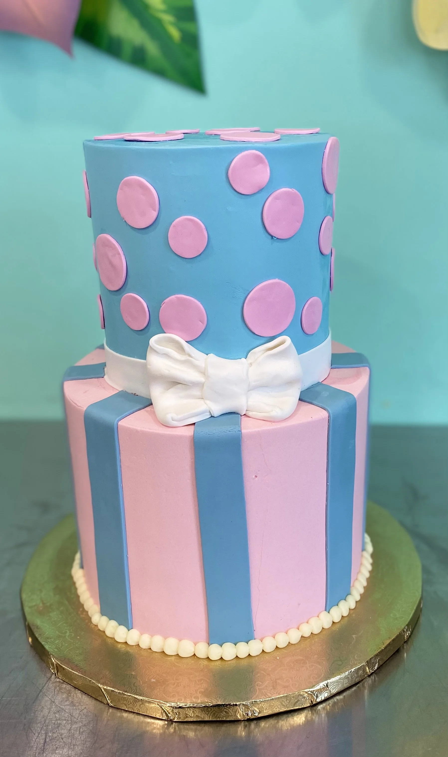 Pink blue polka dots striped two tier birthday cake