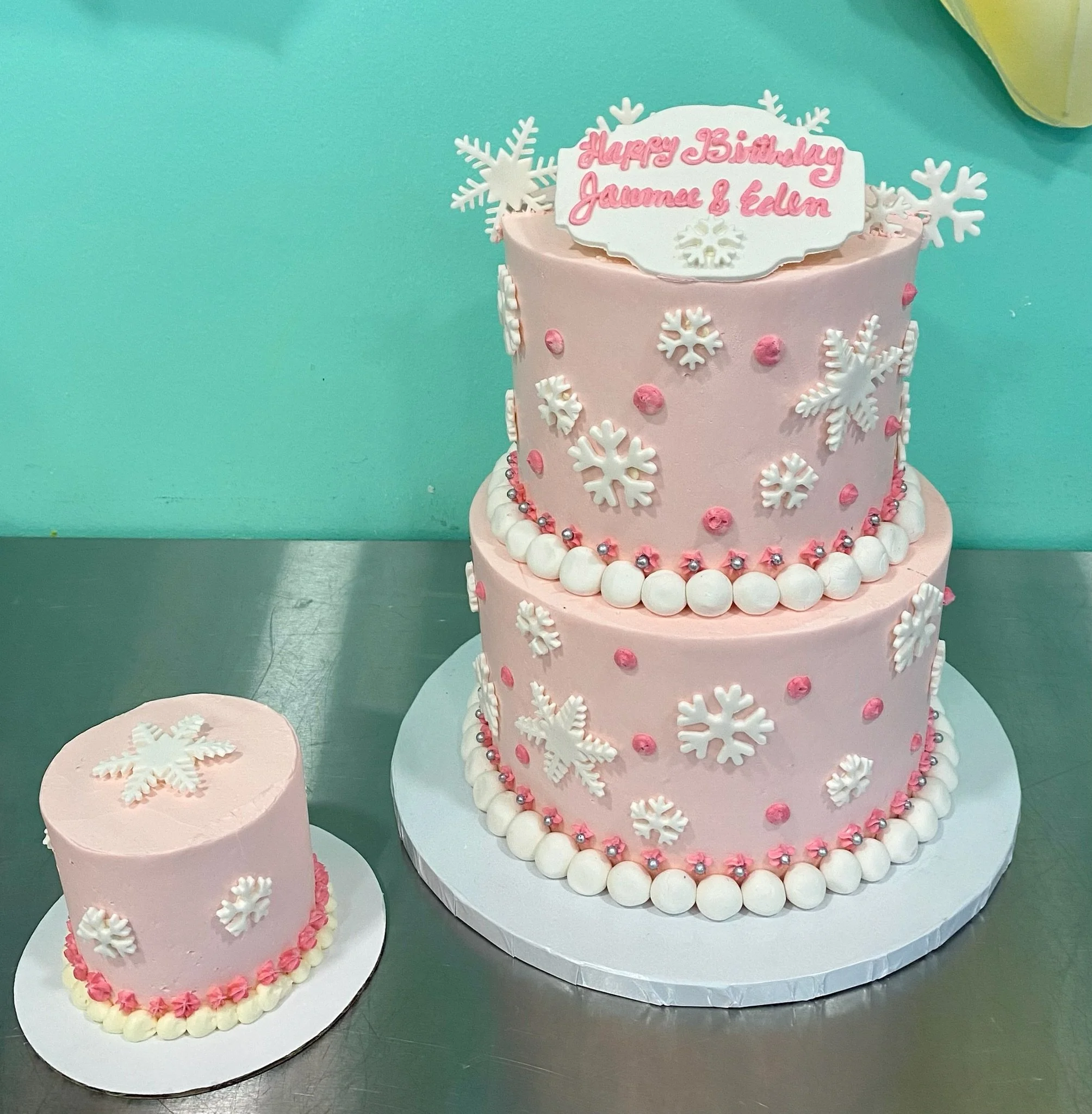 Pink two tier birthday cake white flowers