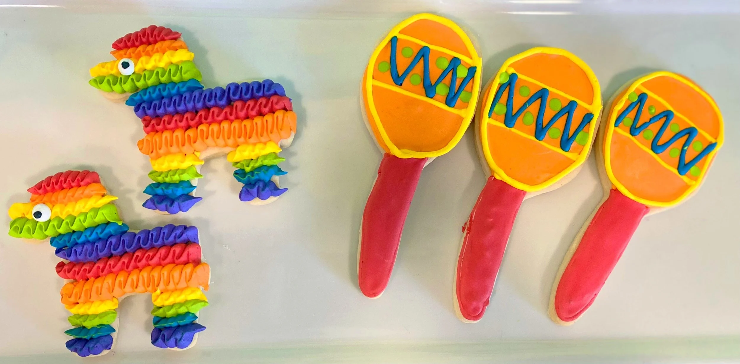 Rainbow first birthday number one cookies
