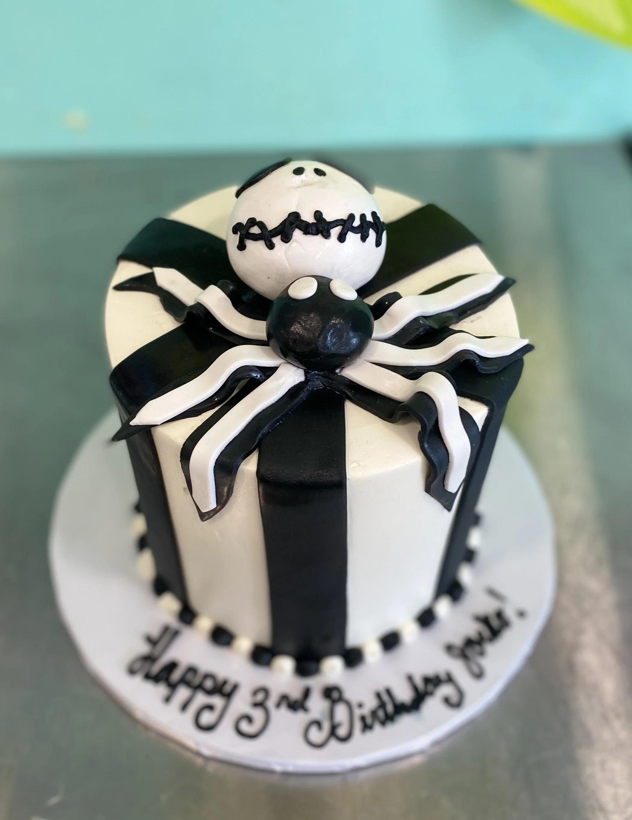 Black white striped bow goth halloween cake