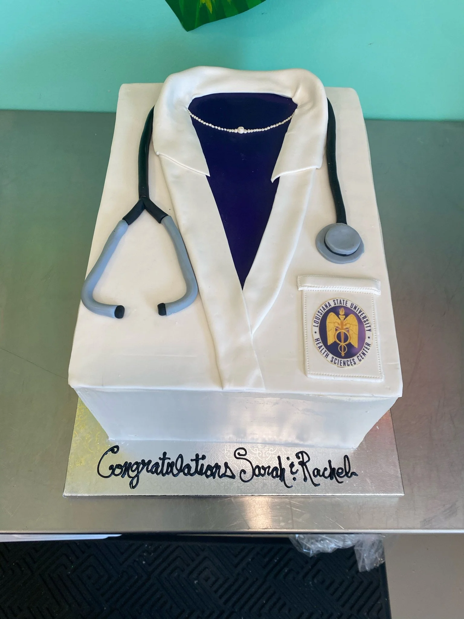 White blue medical coat graduation cake