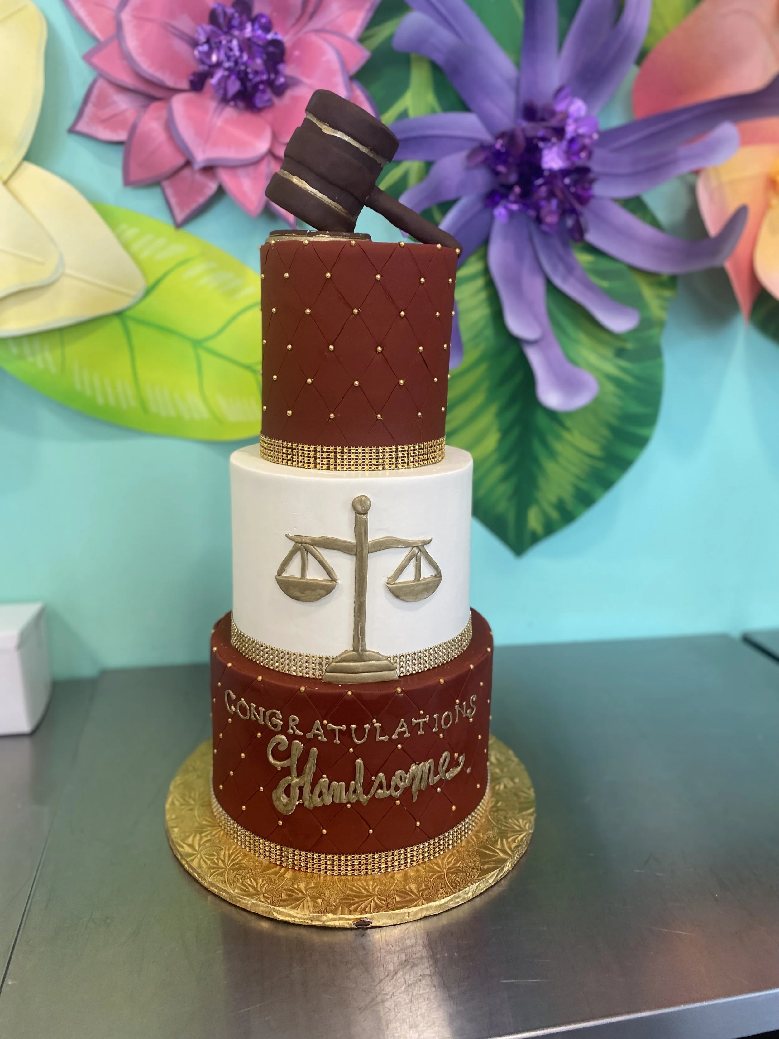 Stacked books graduation cake brown red