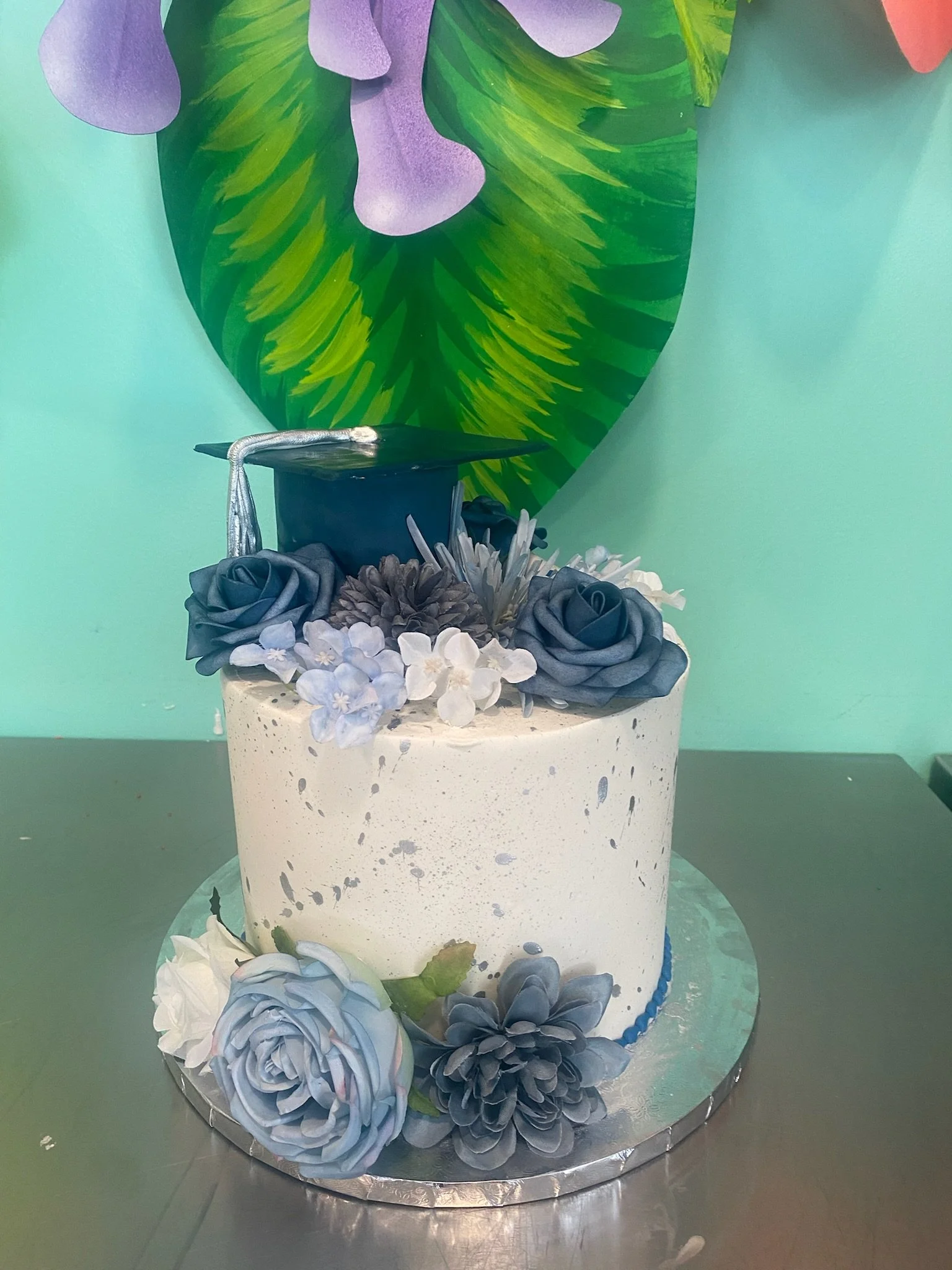 Blue white floral graduation cake