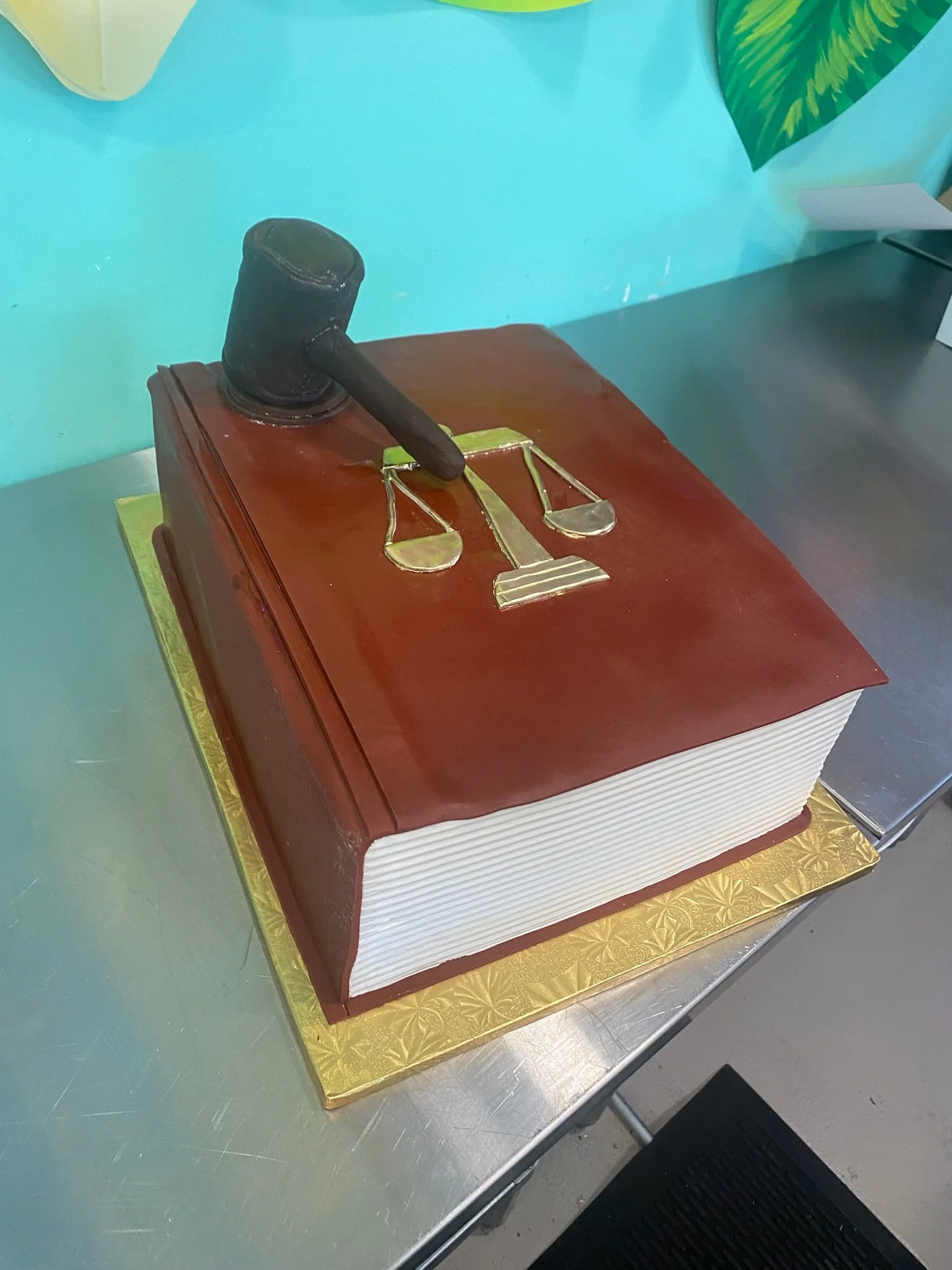 Brown book shaped graduation cake