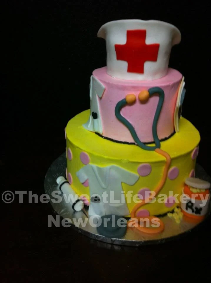 Pink green yellow graduation medical nurse cake