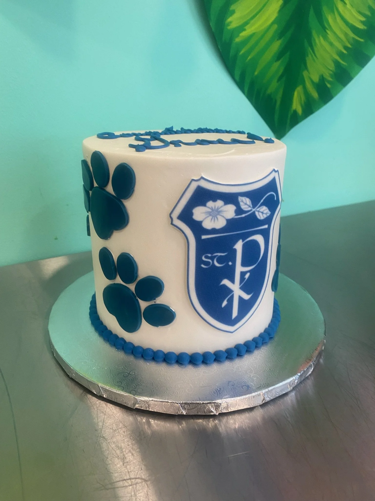 Blue white graduation nursing cake paw prints