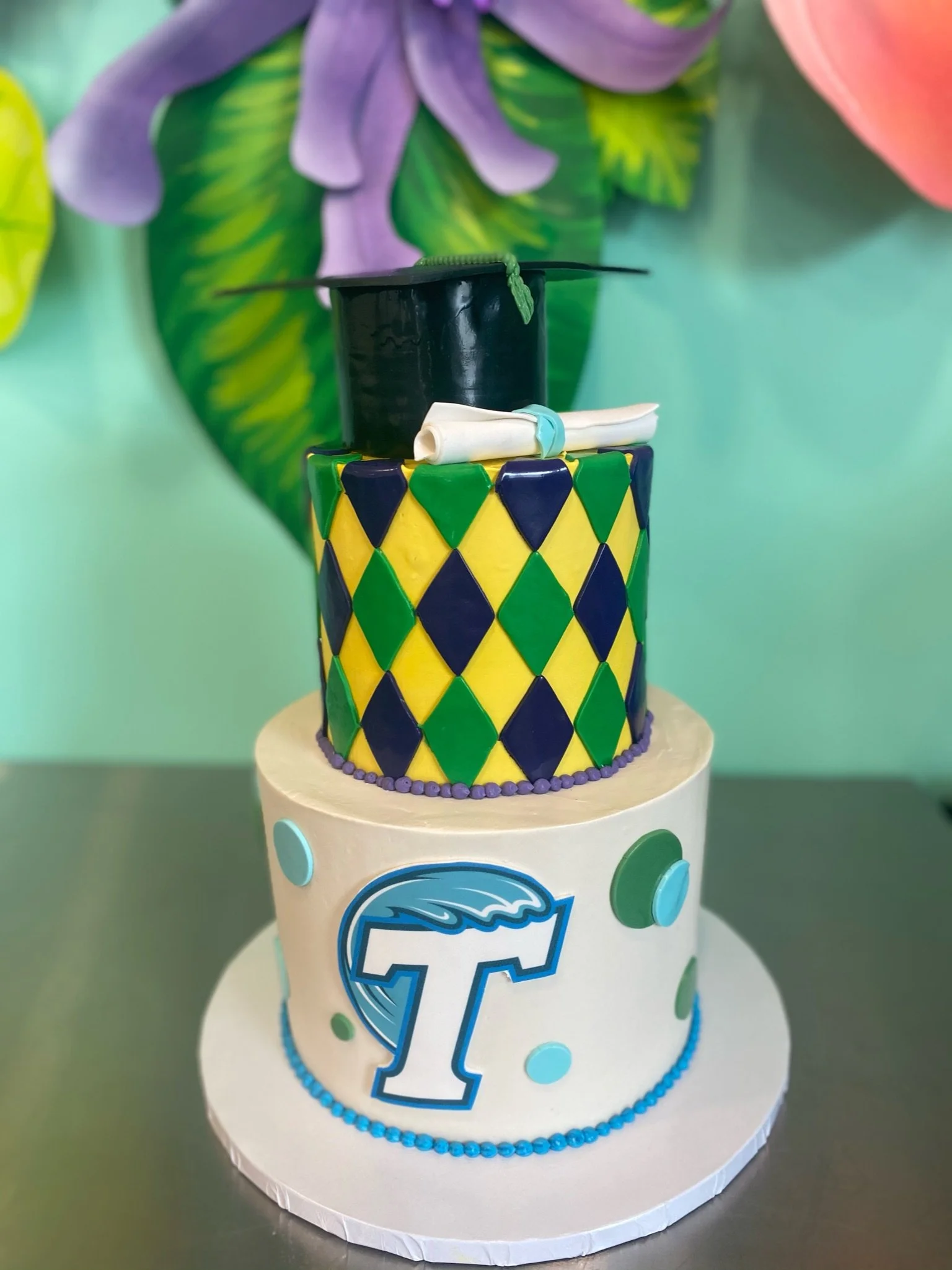 Turquoise black yellow graduation LSU themed tiered cake