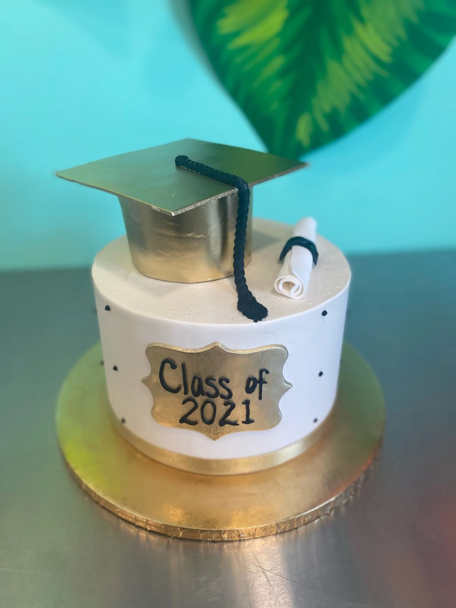 White light blue graduation cap diploma cake