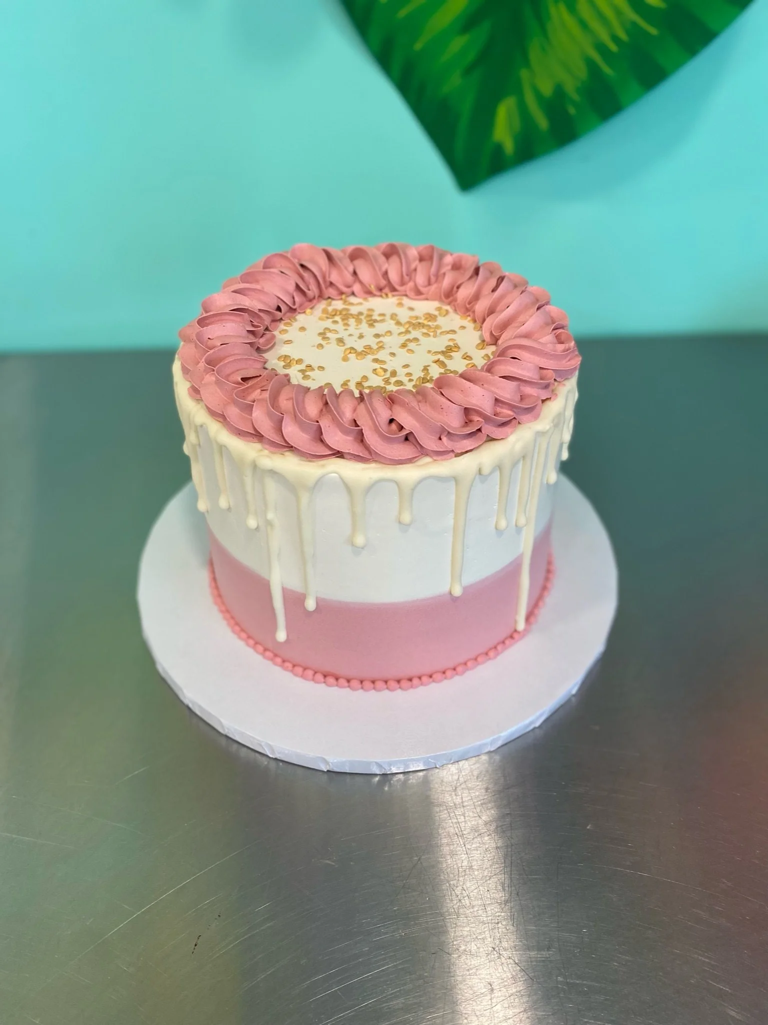 White pink simple baby shower round cake