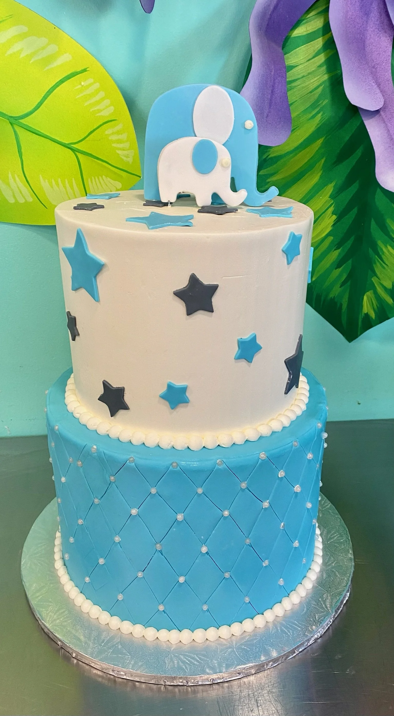 Blue two tier baby shower cake number one stars