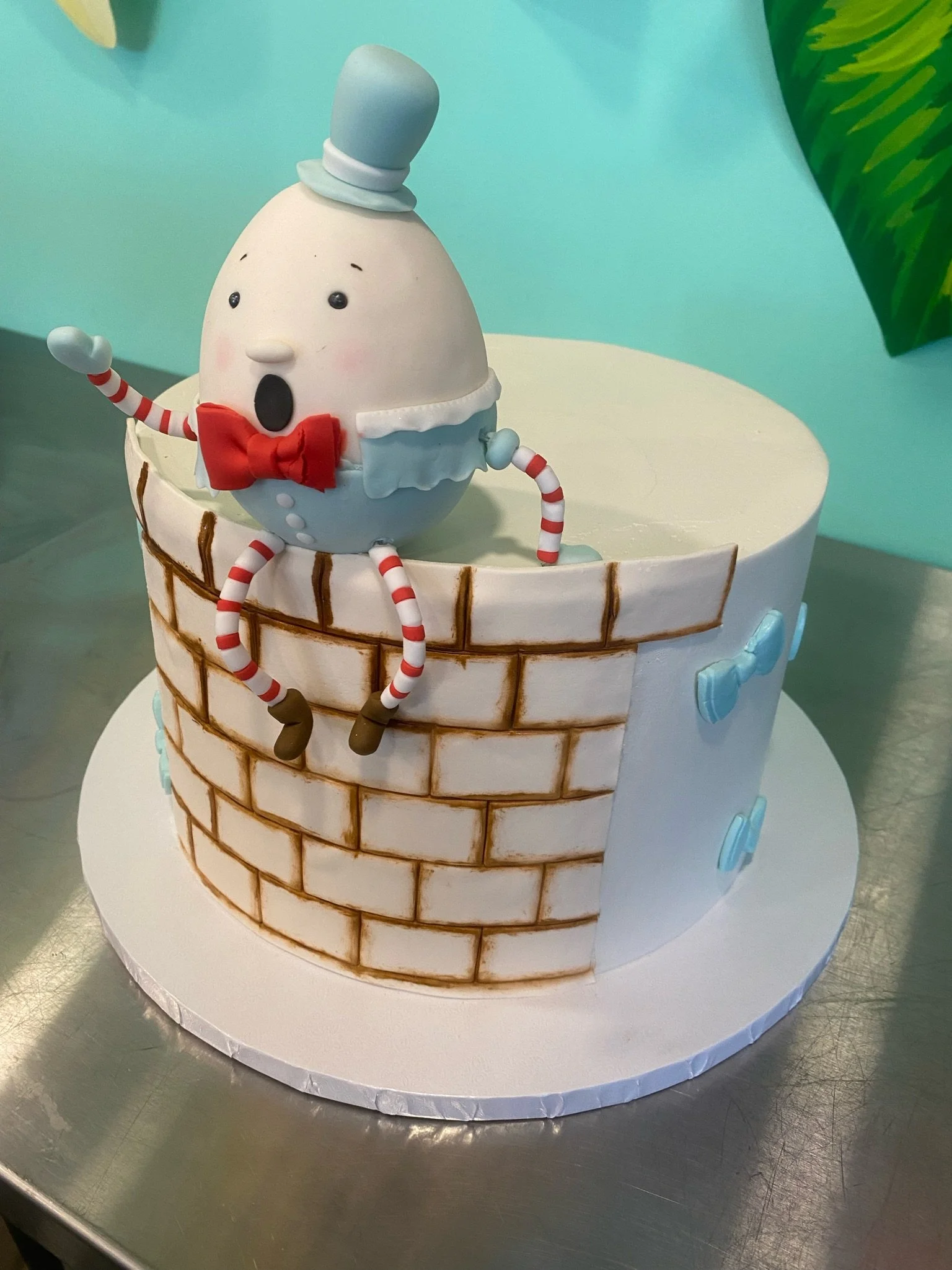 White blue snowman brick wall cake baby shower