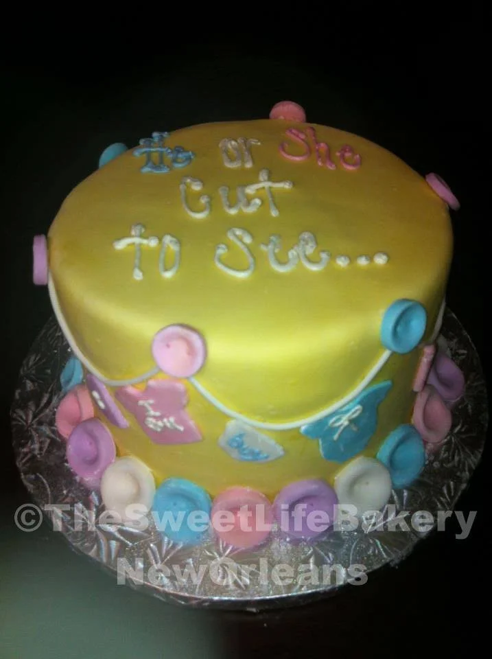 Yellow pink blue baby shower cake bubbles