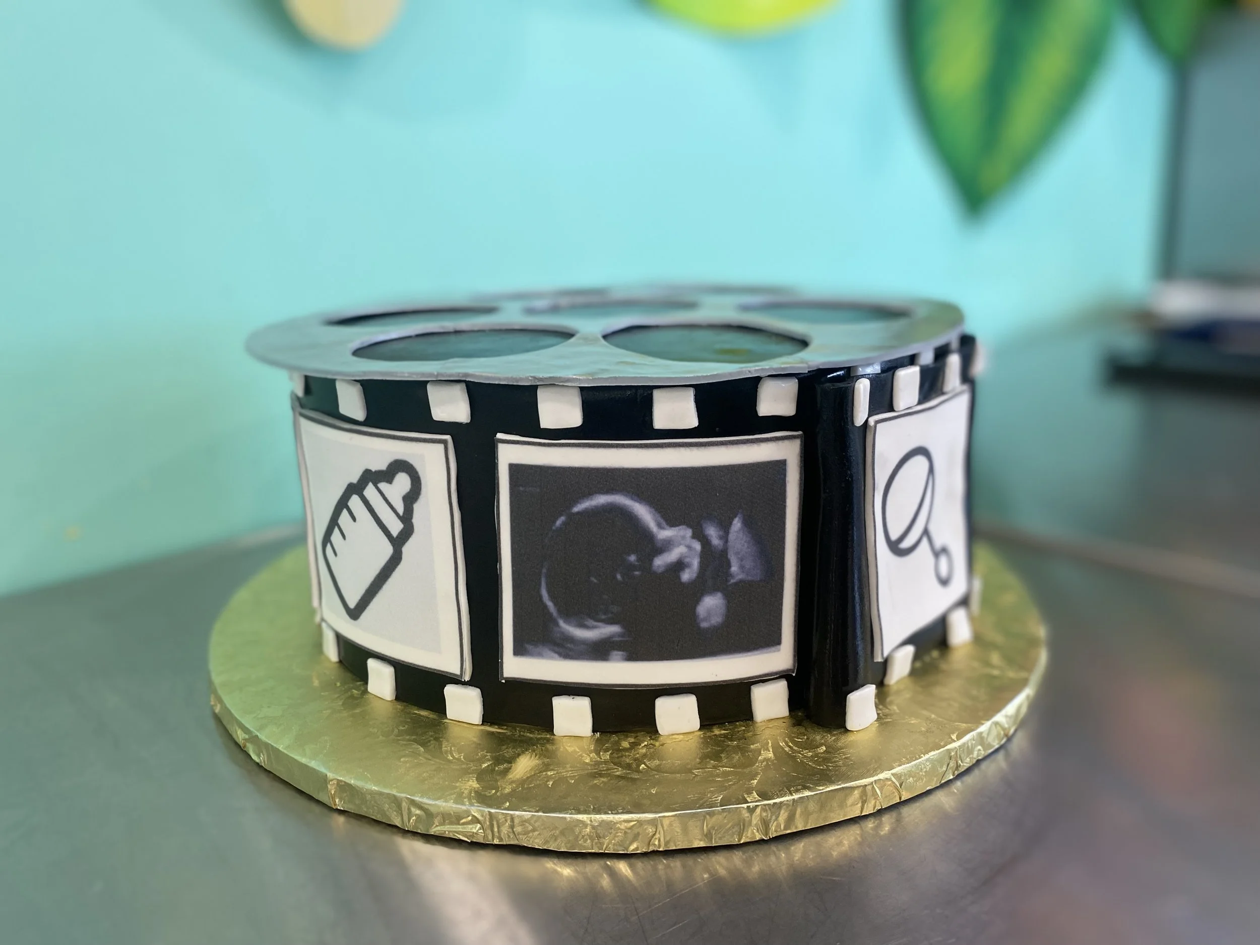 Silver black movie film reel movie theater cake