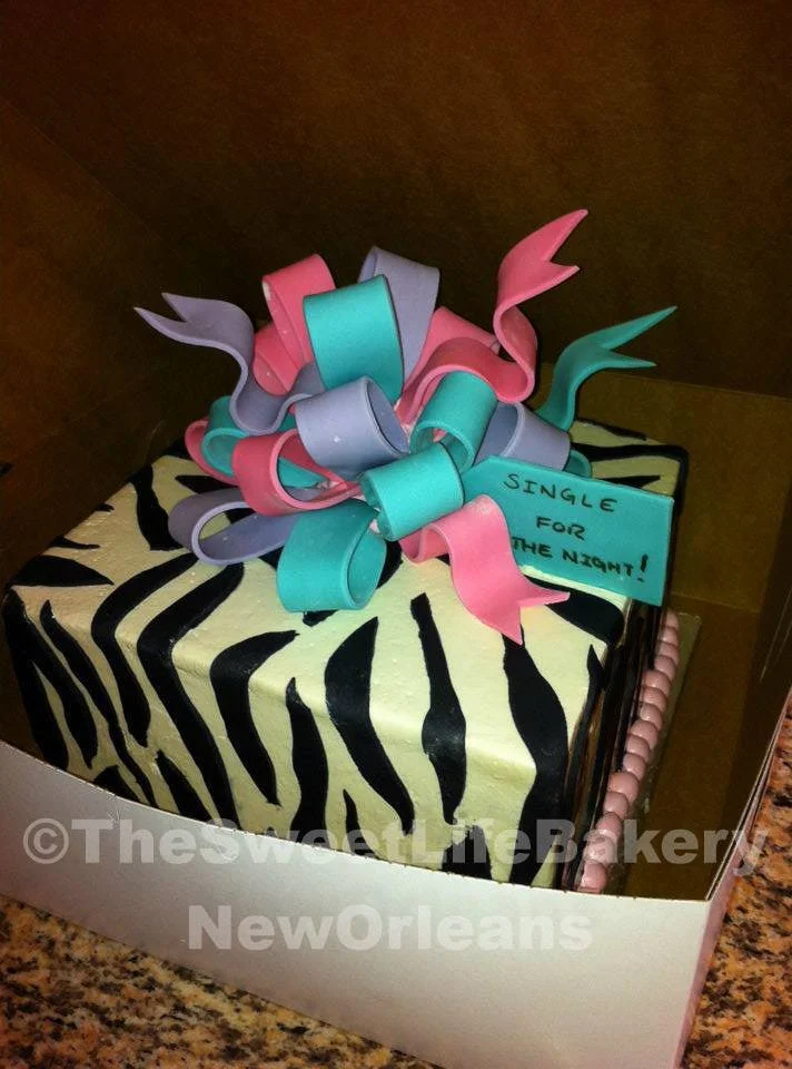 Black white pink baby shower present bow cake