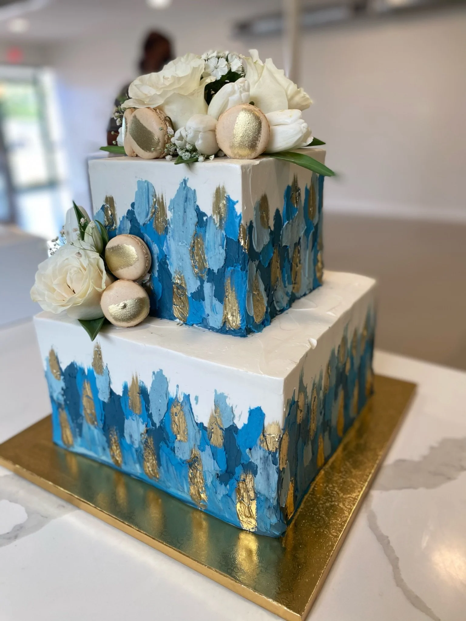 White blue geometric two tier baby shower cake