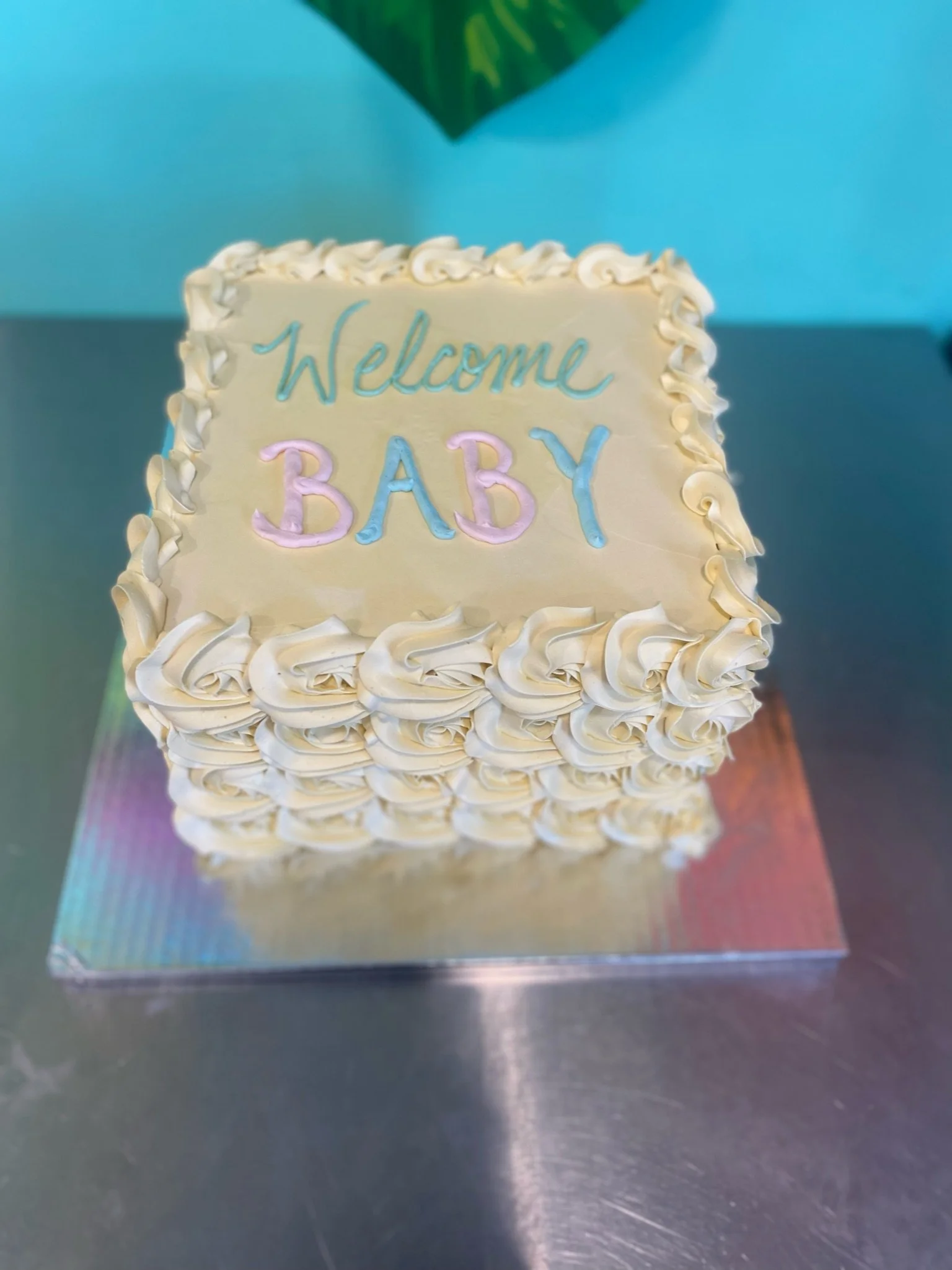 White baby shower sheet cake buttercream piping