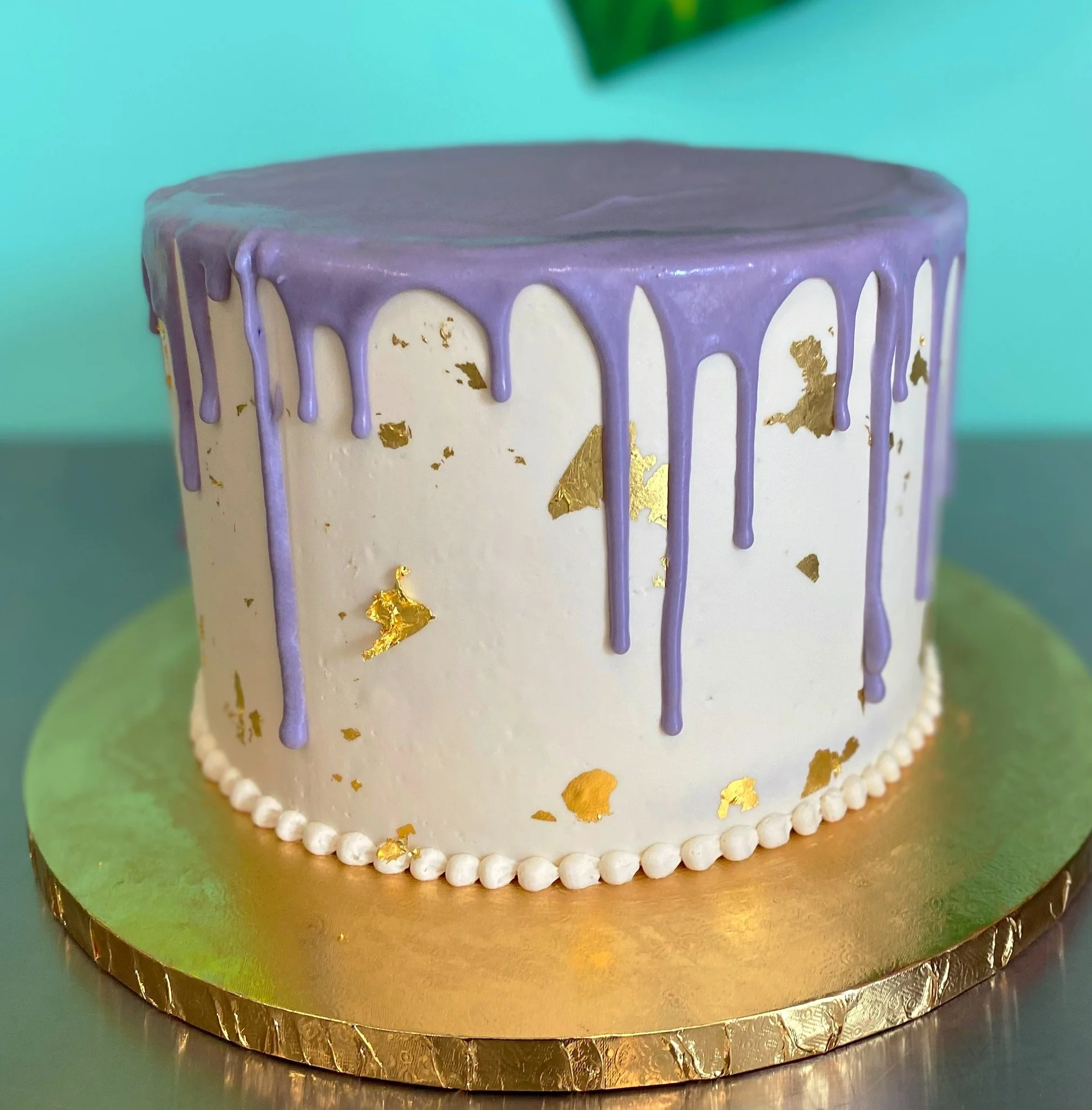 Lavender white gold dripping baby shower cake