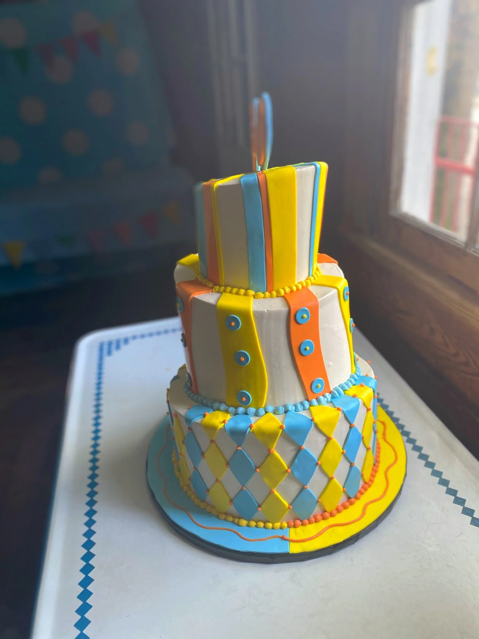 Blue yellow baby shower cake tiered