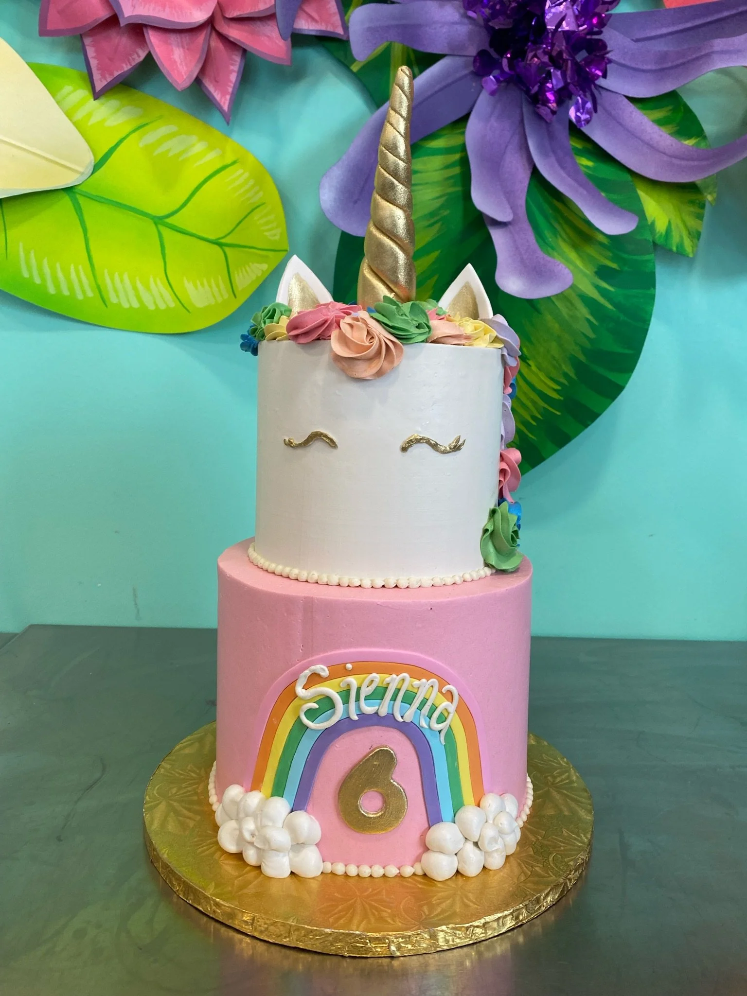 Pink unicorn rainbow baby shower cake